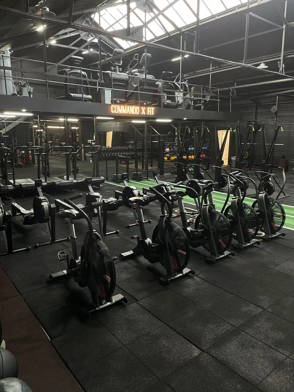 Air bikes and cardio kit on the main floor at Commando X-Fit