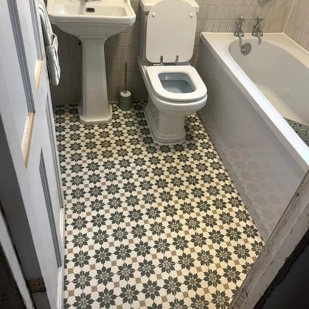 The same bathroom floor cleaned back to the tile pattern