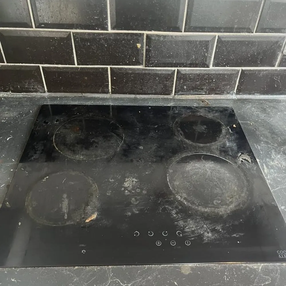 Hob covered in burnt on marks before cleaning