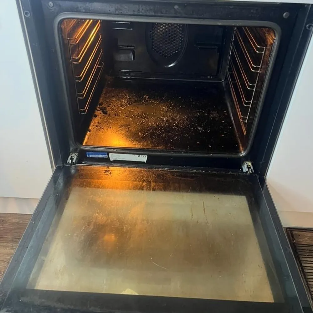 Oven with burnt on grease before cleaning