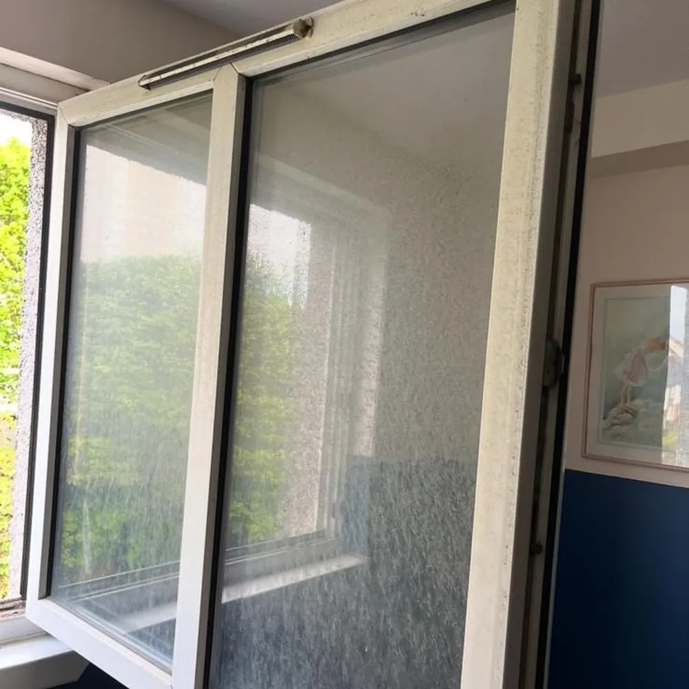 Window frame marked and dirty before cleaning