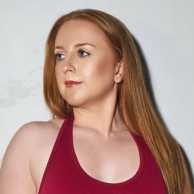 Steph in a red top, side profile, after her transformation
