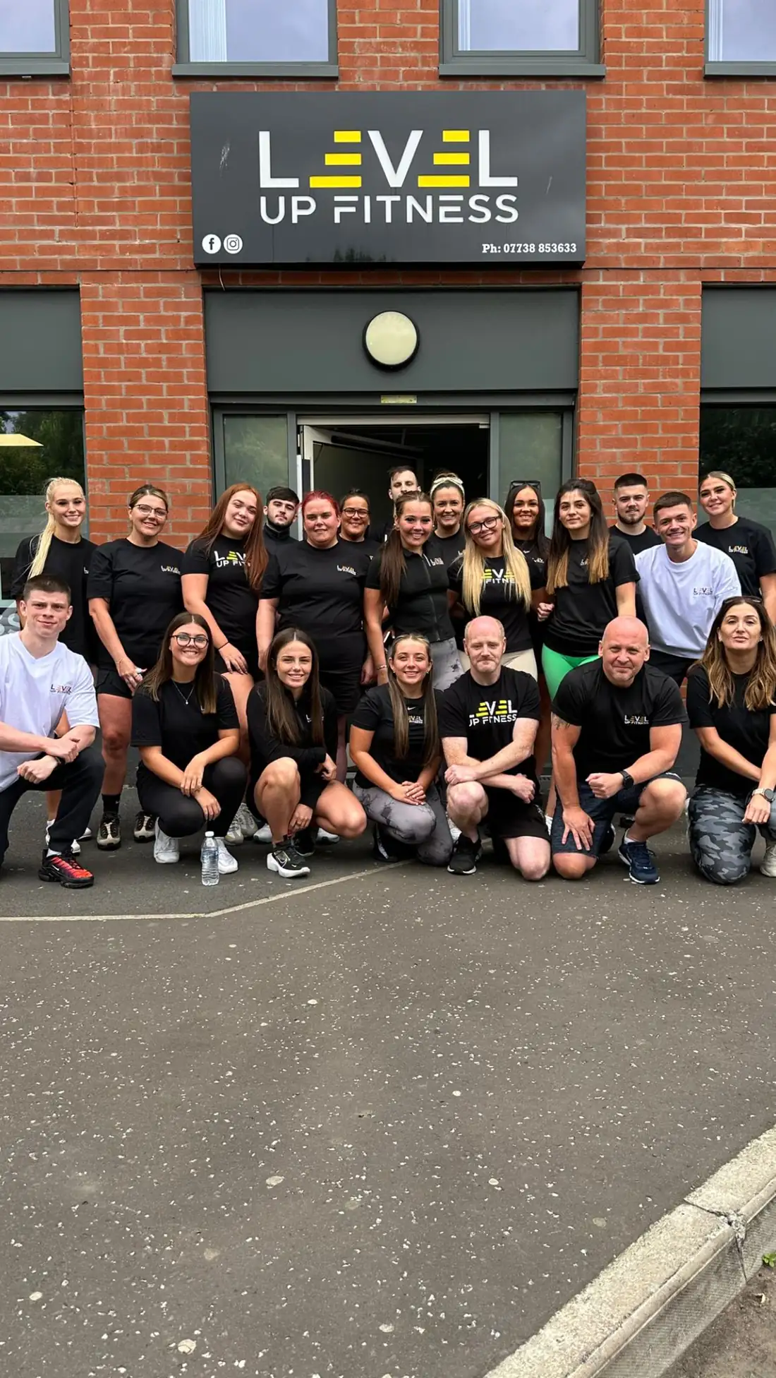 Members and coaches gathered outside the Level Up Fitness gym on Henry Place, Belfast