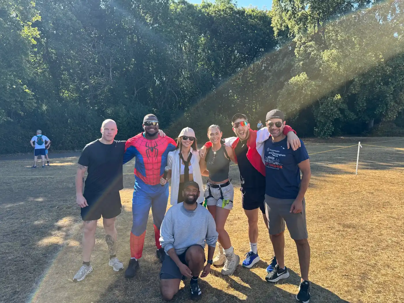 More Life Coaching members together outdoors on a sunny day, one dressed as Spider-Man