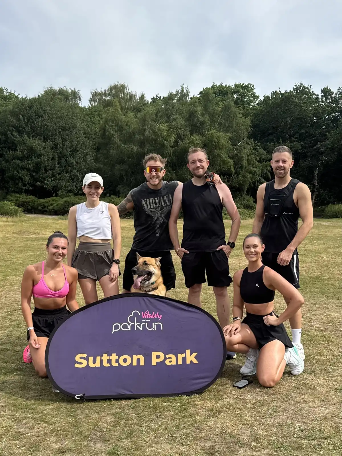 More Life Coaching members and coaches with the Sutton Park parkrun banner